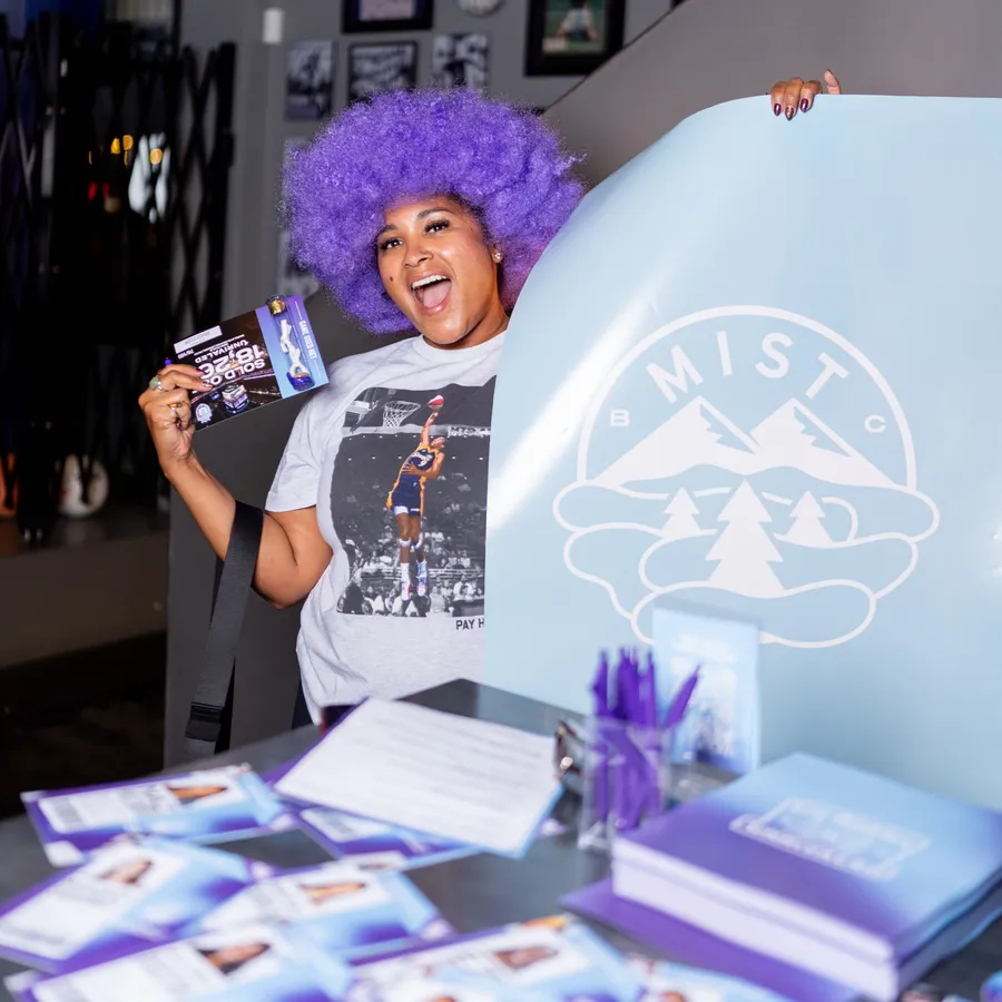 A purple wig, a piece of game-used net, and the Mist banner held high
