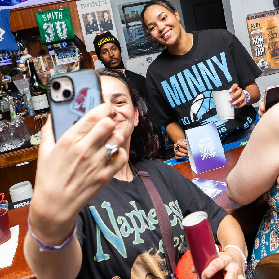 A selfie at the bar in the Minny is Unrivaled tee